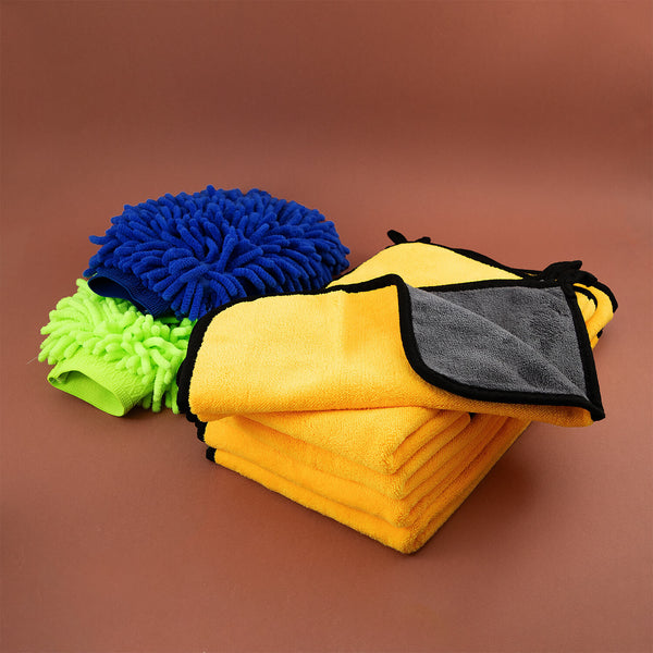 Set of microfiber cloths, microfibre, cleaning cloths, cleaning supplies with different textures on a brown background