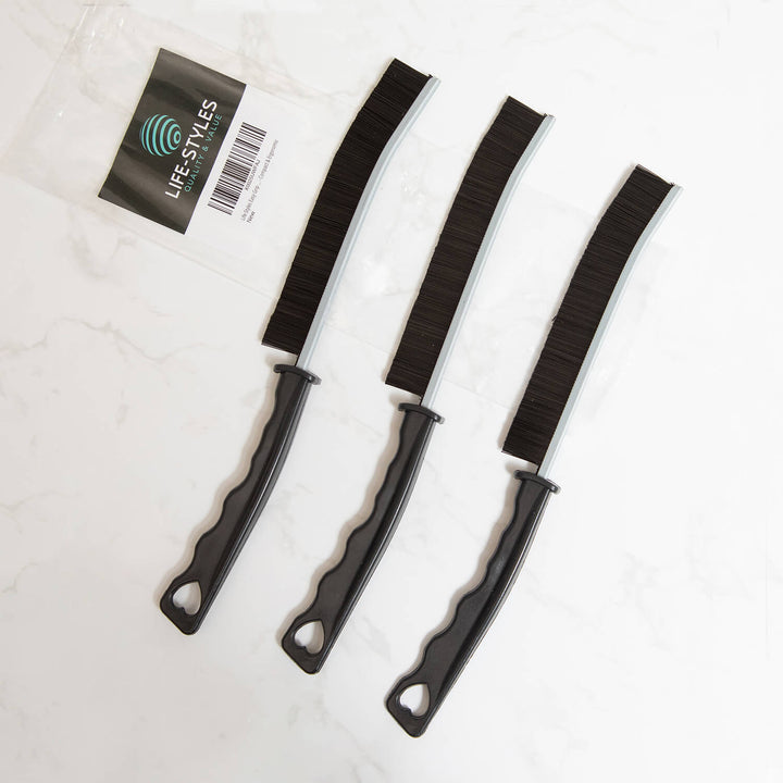 Three black crevice cleaning brushes, cleaning tools, cleaning supplies, microfibre on a white background with a label reading 'LIFE STYLS'.