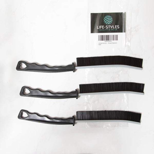 Three black plastic crevice cleaning tools , cleaning supplies, microfibre, with bristle ends on a white background, branded 'Life-Styles'.