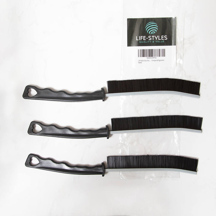 Three black plastic crevice cleaning tools , cleaning supplies, microfibre, with bristle ends on a white background, branded 'Life-Styles'.