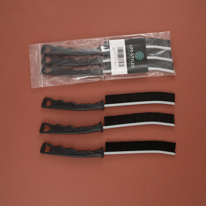 Black and white crevice cleaning tools, microfibre, cleaning supplies with a 'LIFE STYLES' label on a brown background